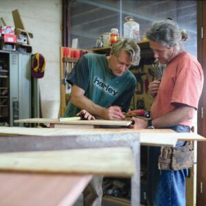 Gary Bennett and David Paris discussing design and details of their next piece of furniture